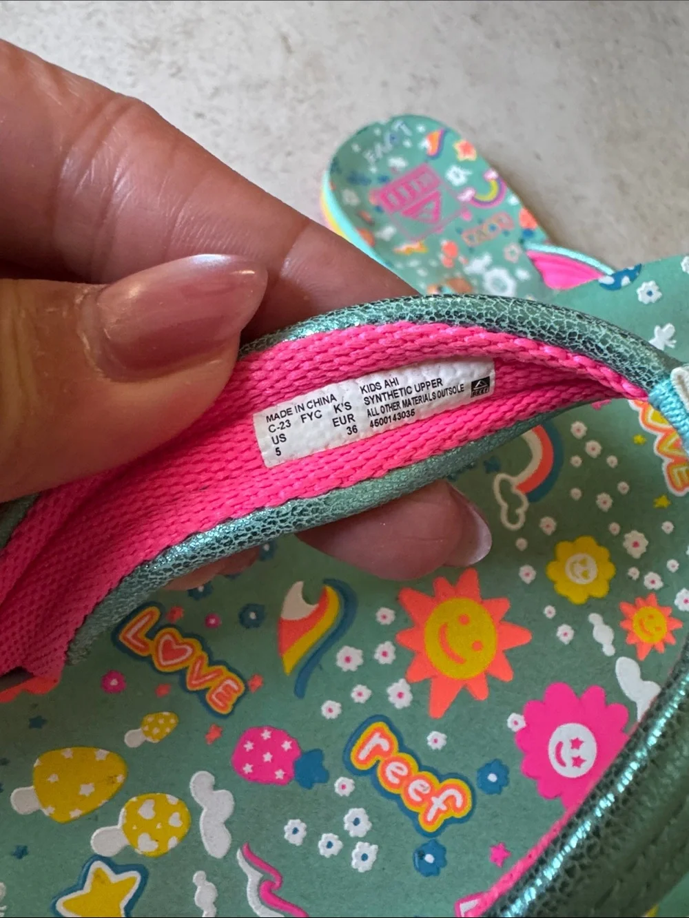 Reef Big Girls Teal Rainbow Print Flip Flops with Pink Accents